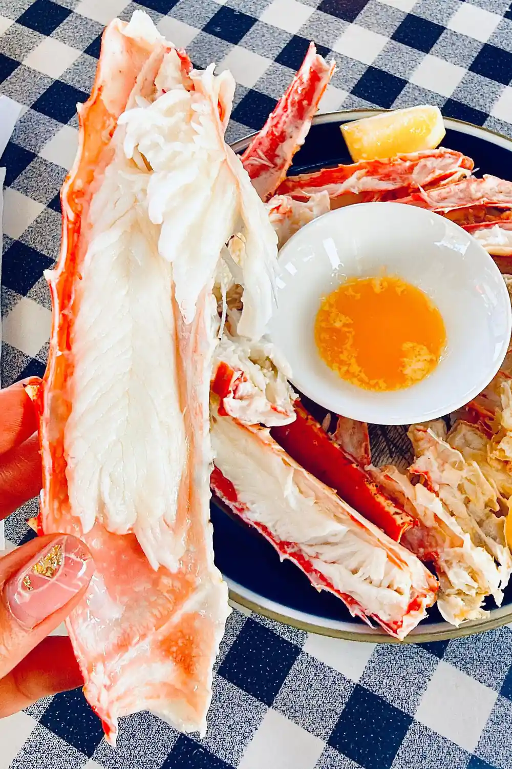 Close view of white crab meat and butter on a plate